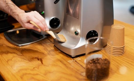 a man clean coffee machine at home